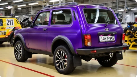 Same Niva rendered in Super Chrome Purple Satin, rear three-quarter view